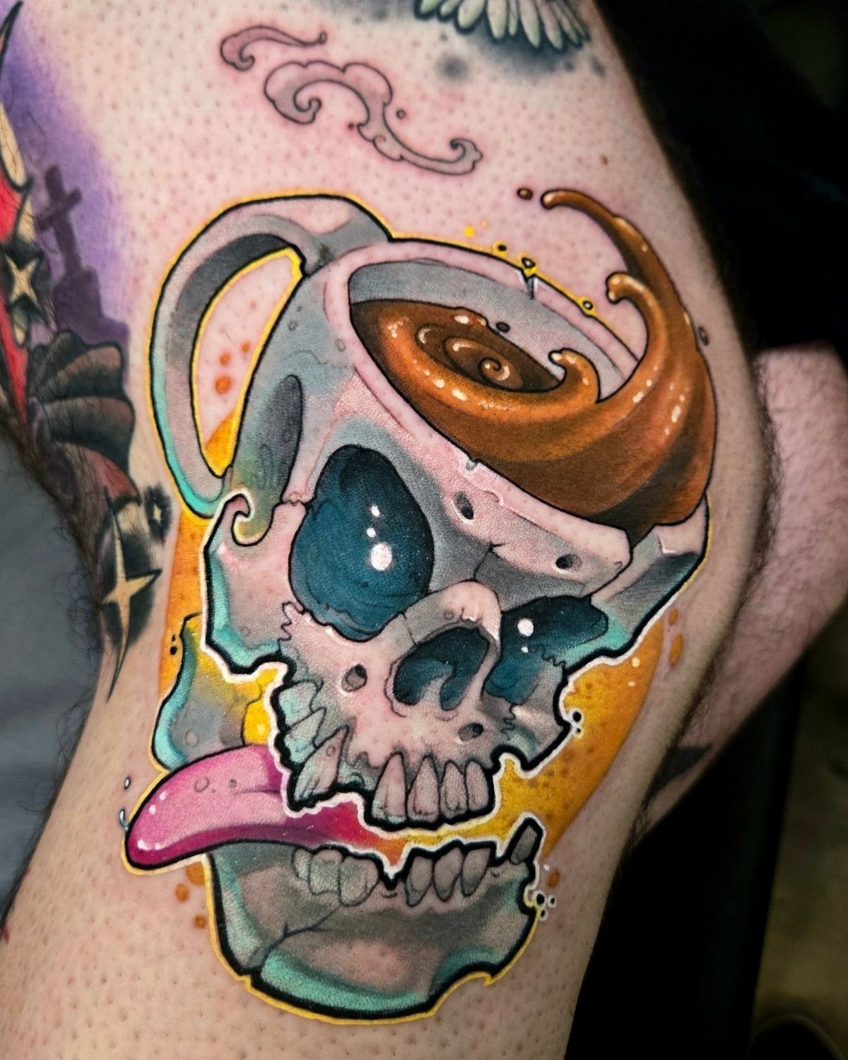 An illustrative tattoo of a skull shaped like a coffee cup with splashing liquid and a pink tongue.