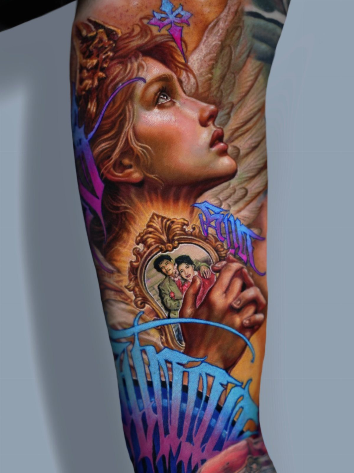 A detailed colorful realism tattoo of a woman's face and hands on a person's arm.