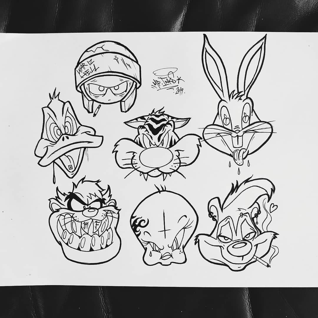 Black ink line art drawings of various whimsical cartoon character faces on white paper.