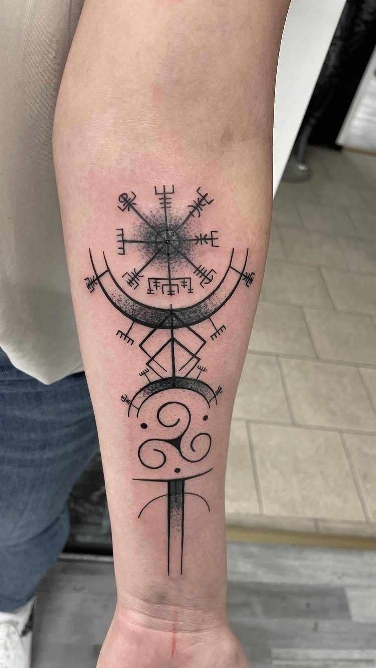 Rune Tattoo Ideas: 18 Symbols and Placements Worth Studying 3 A black ink Vegvisir compass tattoo with runic patterns on a person's forearm.