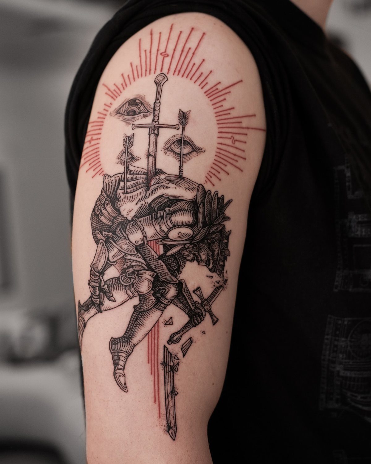 A woodcut style tattoo of a knight in armor with a sword and sunburst on an arm.